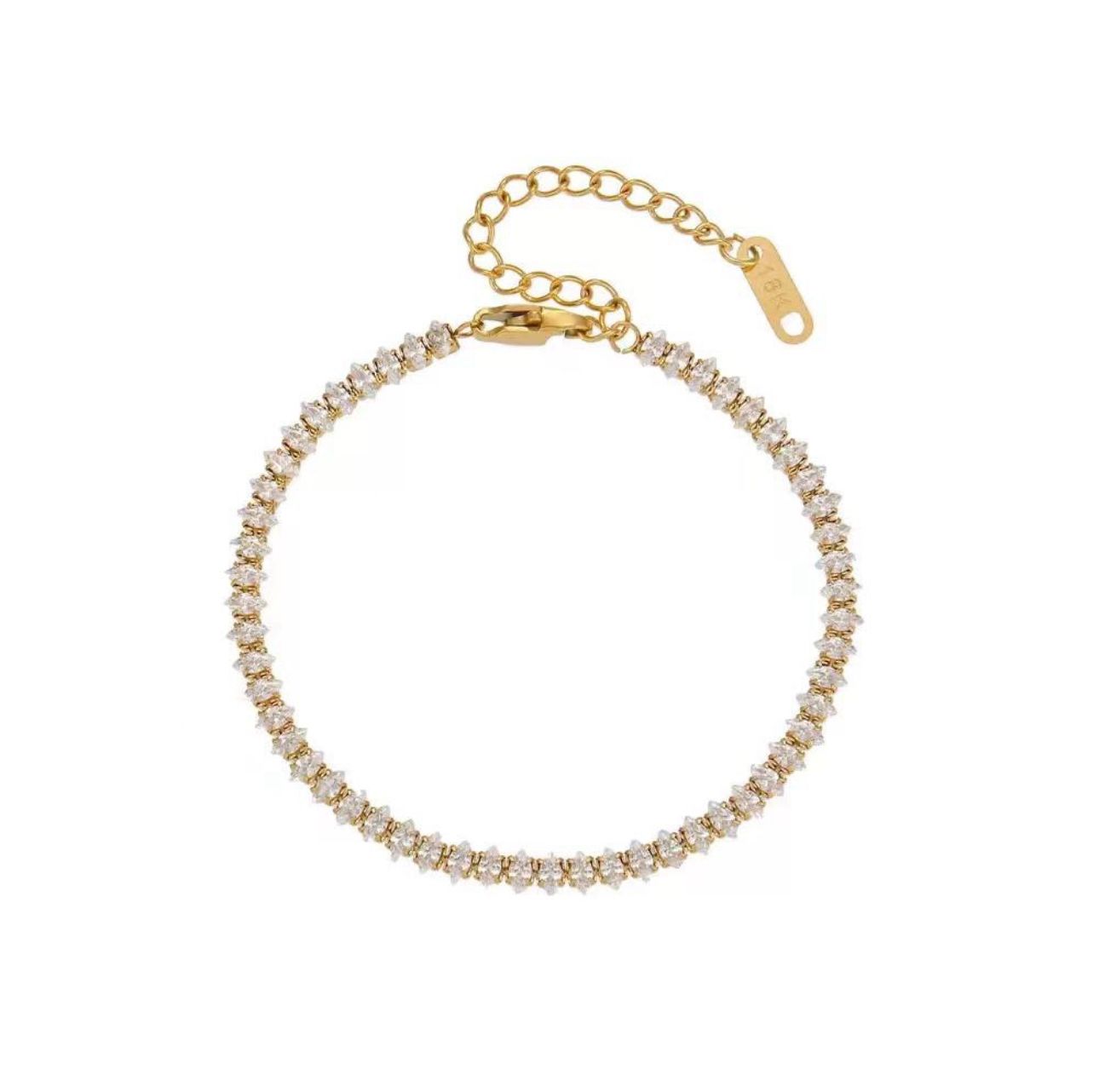 Gold rhinestone bracelet with clear stones on a white background